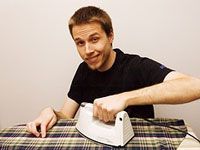 Happy guy ironing