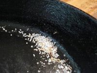 skillet with salt and cooking oil
