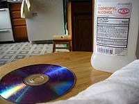 bottle of rubbing alcohol by a disc