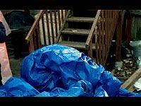 blue tarp over deck items