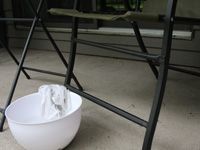 bowl of cleaner in front of patio furniture