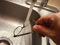 glasses under a running tap