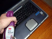 canned air spraying laptop