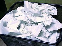 garbage can full of paper
