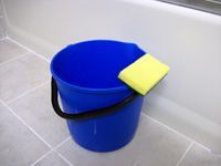 a blue bucket and yellow sponge