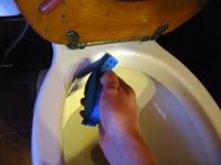 Scrubbing toilet rim