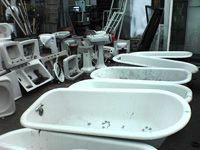 row of old bathtubs
