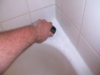 scrubbing bathtub with baking powder