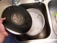 vinyl record in soapy water