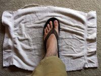 stepping on towel to increase soaking
