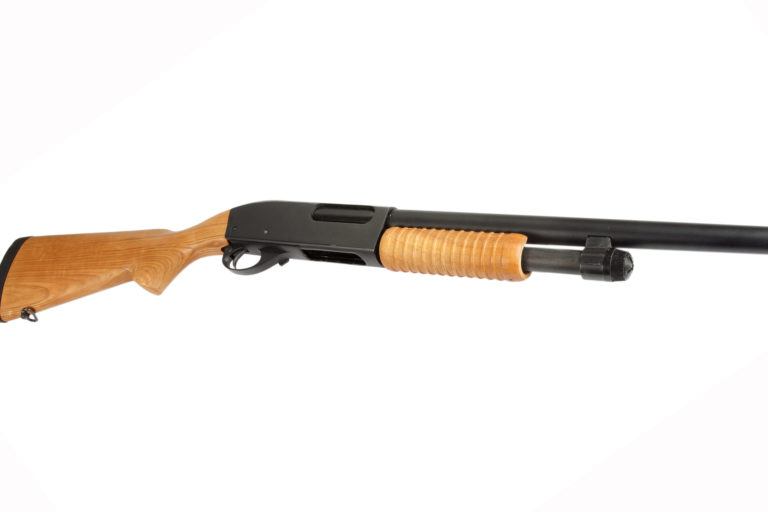A pump shotgun on a white background.